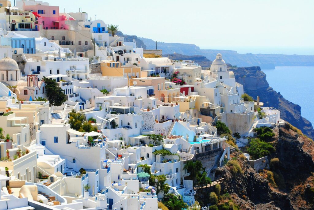 Breathtaking view of Santorini's iconic white and blue architecture against the Aegean Sea.