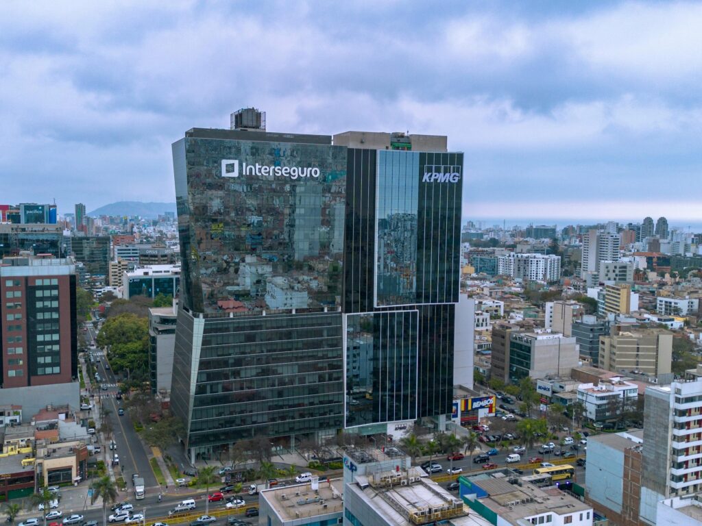 Aerial view of modern skyscrapers in Lima, Peru, showcasing urban architecture and corporate buildings.