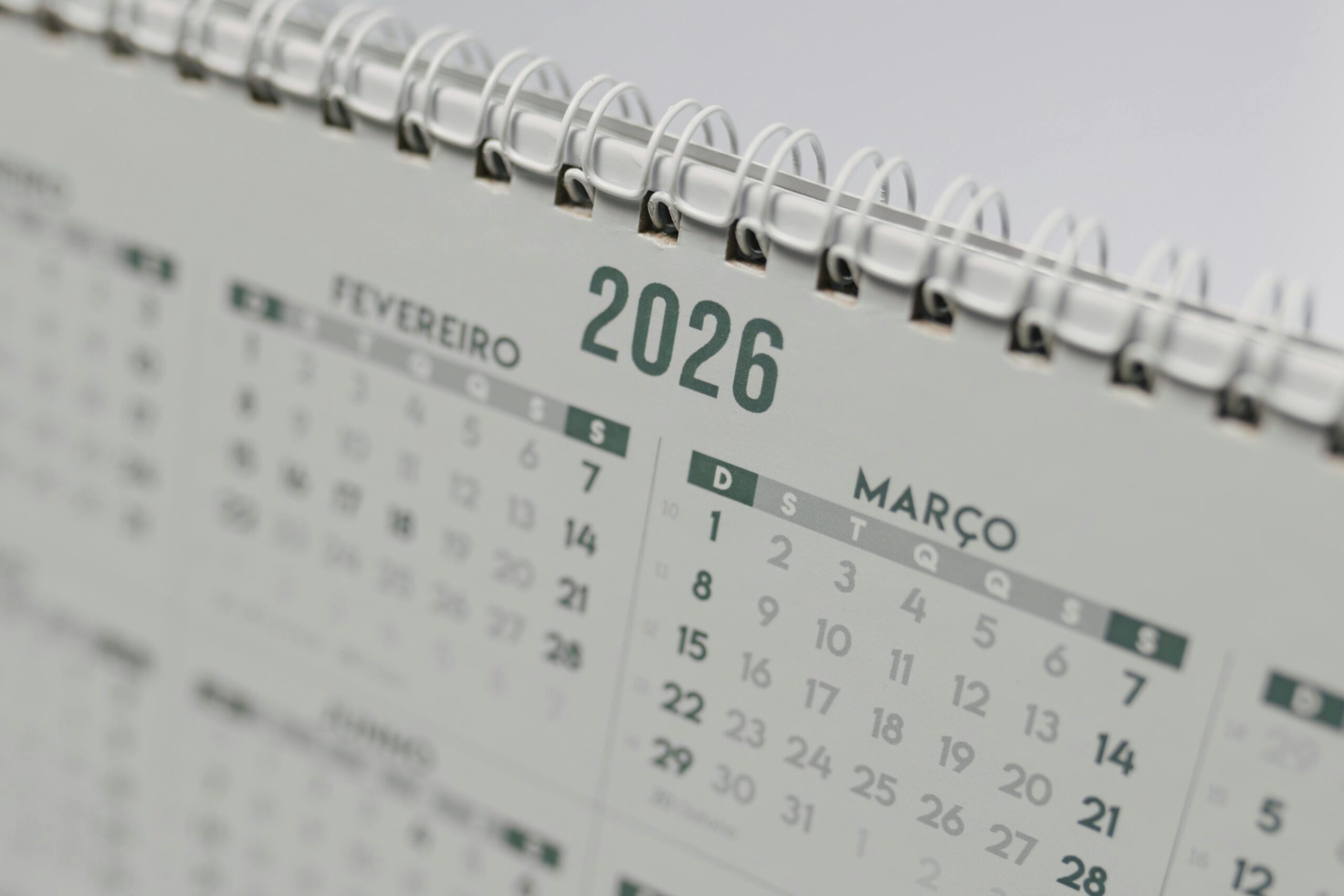 Close-up view of a 2026 spiral-bound desk calendar showing February and March.