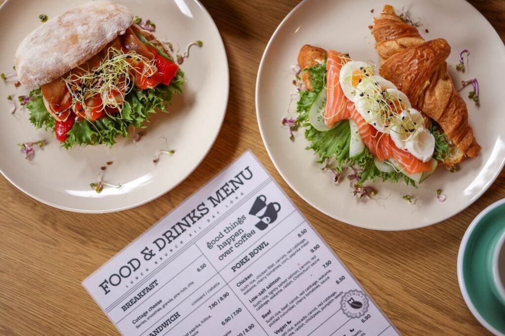 pexels-photo-27969839-27969839 Tasty croissant sandwich with salmon and ciabatta with vegetables, perfect for a balanced meal.