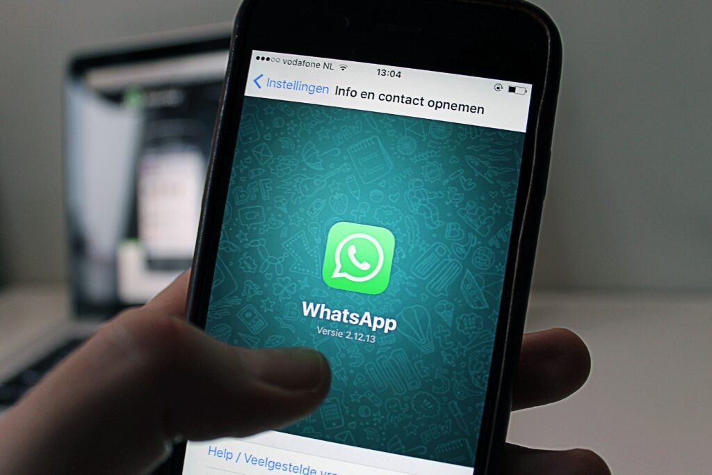 pexels-photo-46924-46924 A smartphone displaying the WhatsApp application screen held by a person.