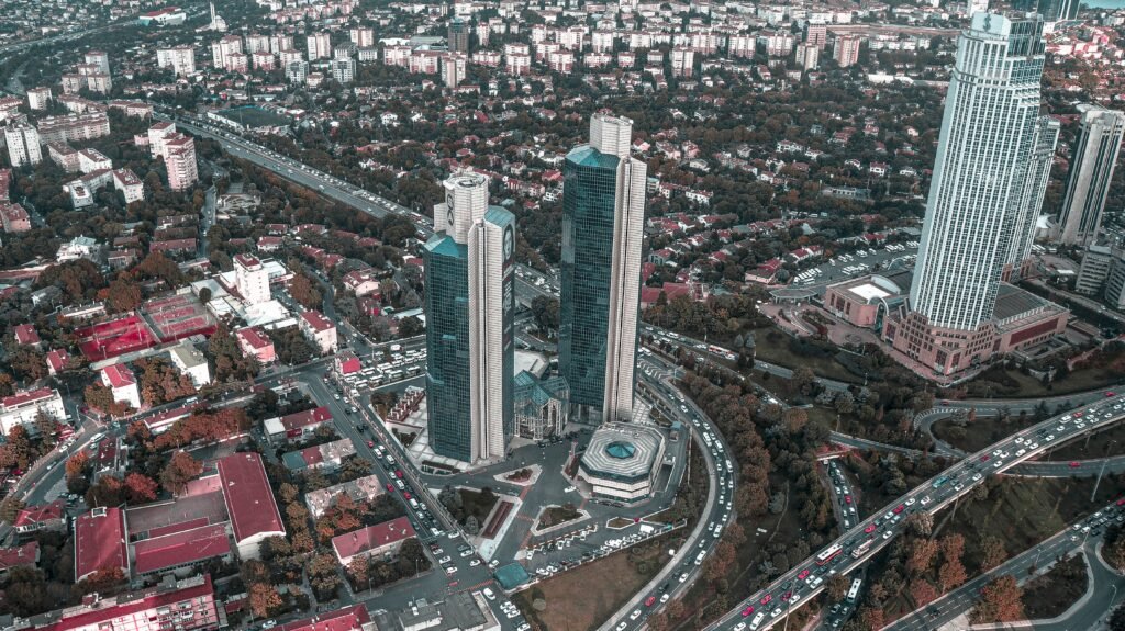 Aerial view showcasing modern skyscrapers and bustling urban streets below.